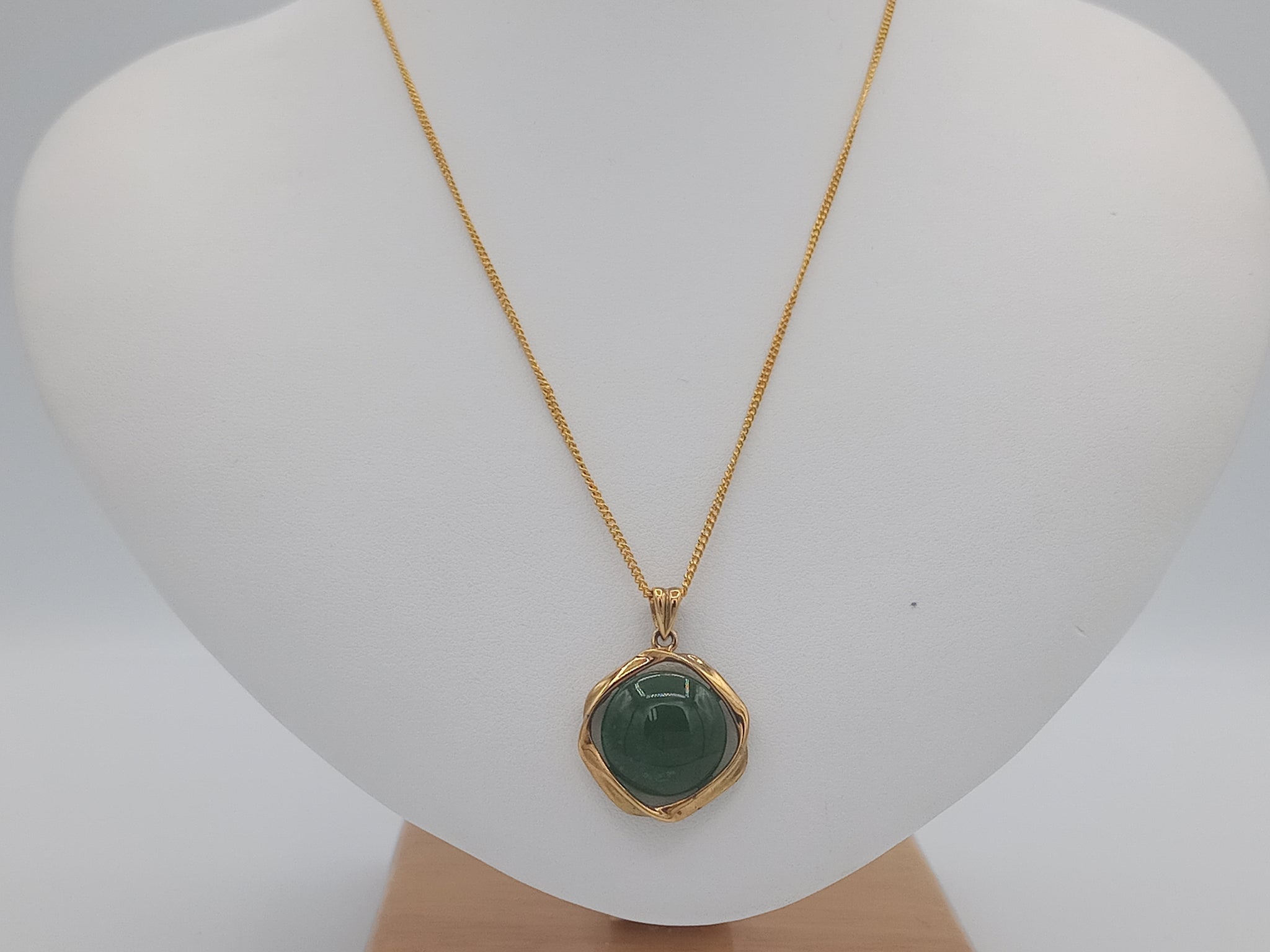 Eye shaped jade in gold plated pendant