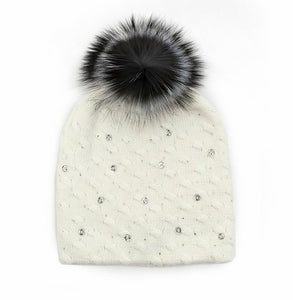 Knitted beanie with sequine and fox fur pom